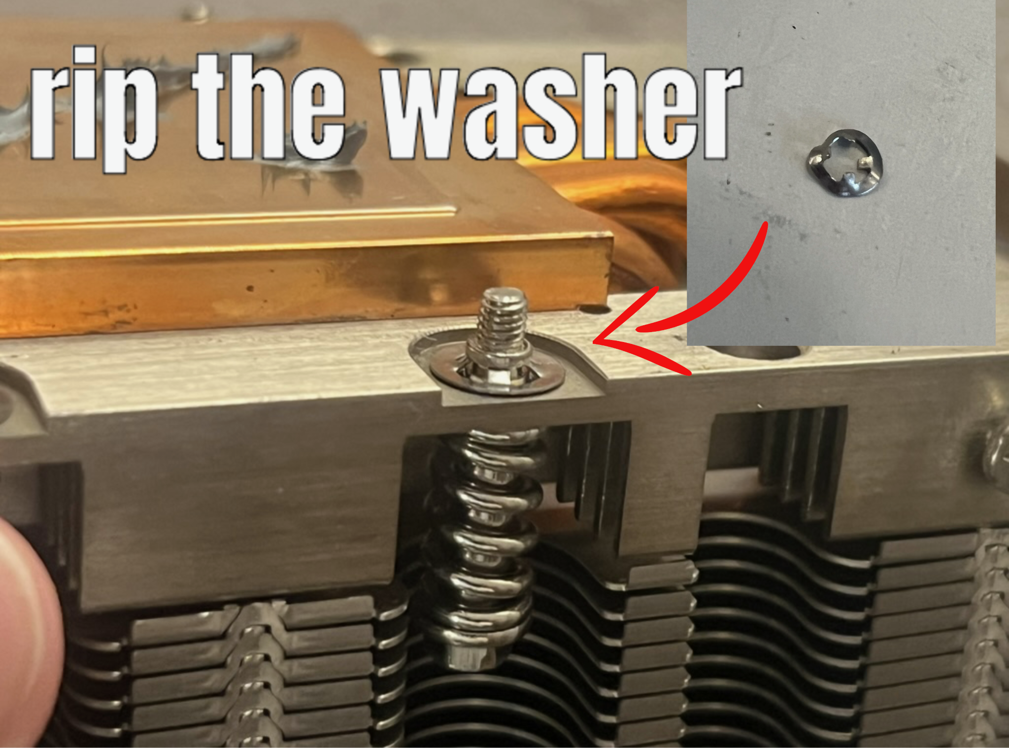 Picture of the poor spring retention washer after we removed it with a flat head screw driver and a hammer.